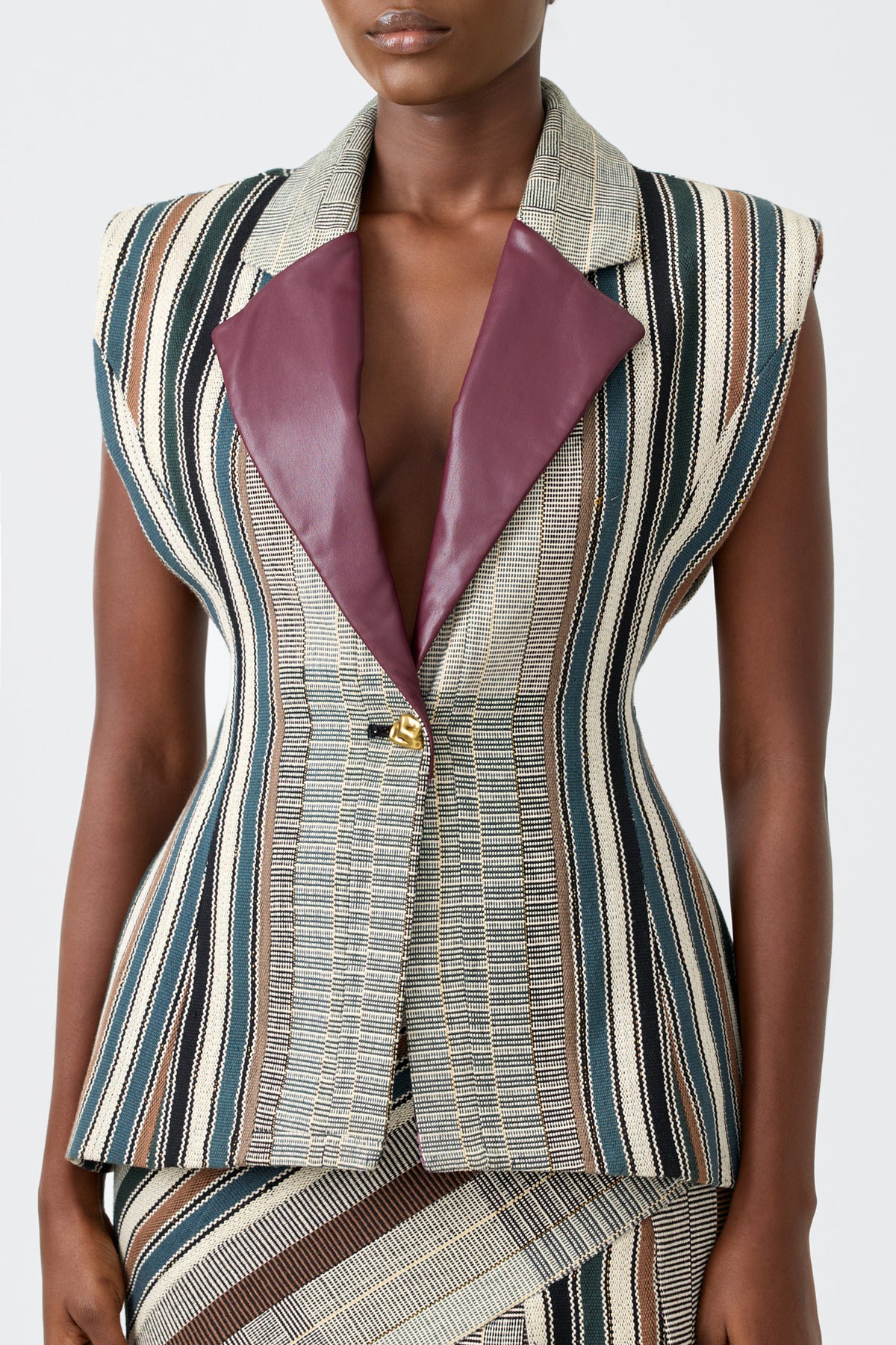 SERAFINA sleeveless kente blazer with contrast vegan leather lapel