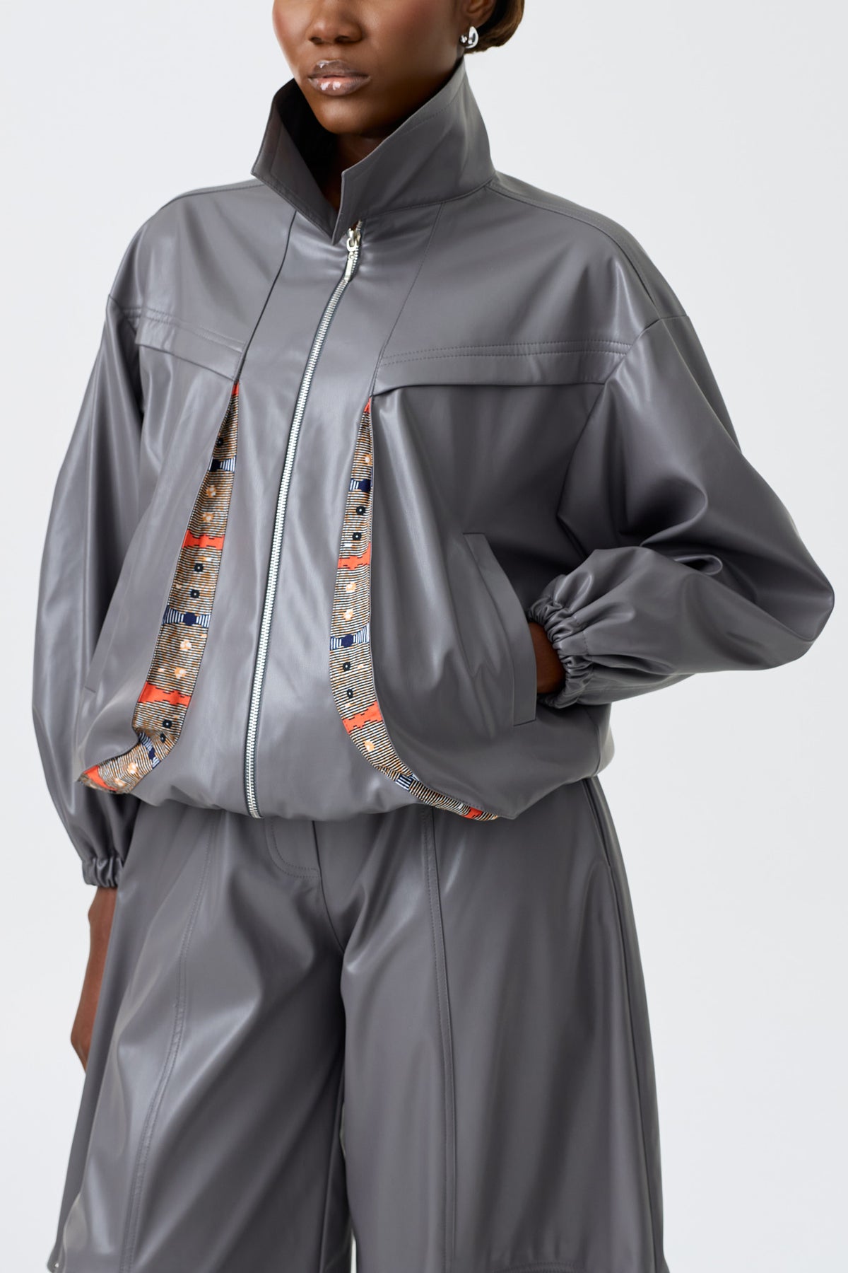 RENEE GREY long sleeve vegan leather bomber jacket with cut-out back detail